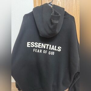 Fear of God Essentials Black Hoodie with White Text